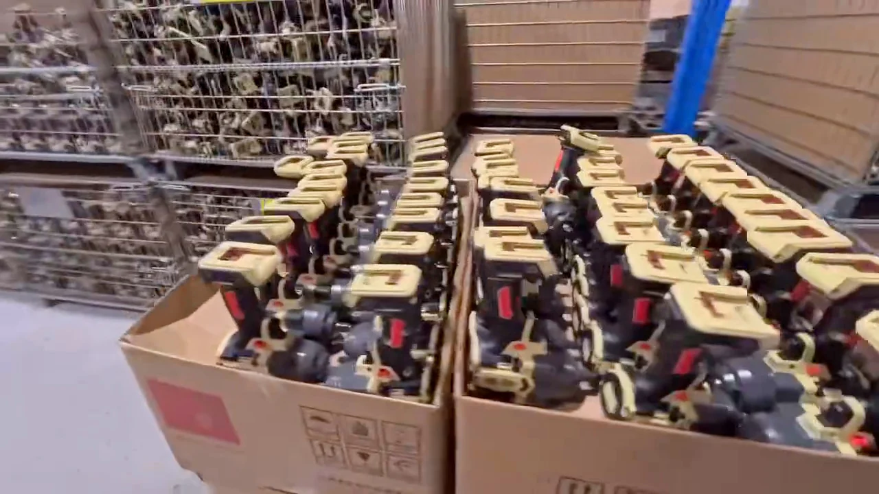 Assembled cordless tools in cartons and stillages waiting to be packed